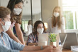 © goodluz - group of students working wearing masks