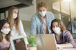 © goodluz - group of students working wearing masks