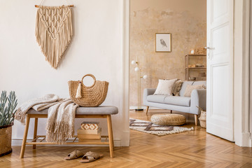 Wall Mural - scandinavian interior of open space with wooden bench, grey sofa, pillows, palid, mock up picture fr