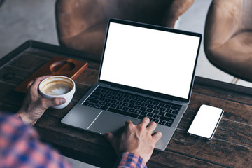 computer,cell phone mockup image blank screen with white background for advertising,hand woman work using laptop texting mobile contact business search information on desk in cafe.marketing,design