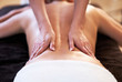 © Kalim - Relaxed woman receiving back massage