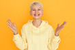 © Anatoliy Karlyuk - Positive human facial expressions, emotions, reaction and feelings. Happy energetic retired woman with short pixie hairstyle having joyful look, gesturing emotionally, rejoicing at good news