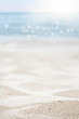 blurred of the sea and sand in the summer for abstract background
