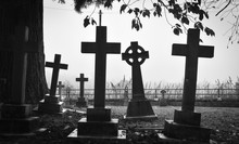 Cross On Cemetery Against Sky
