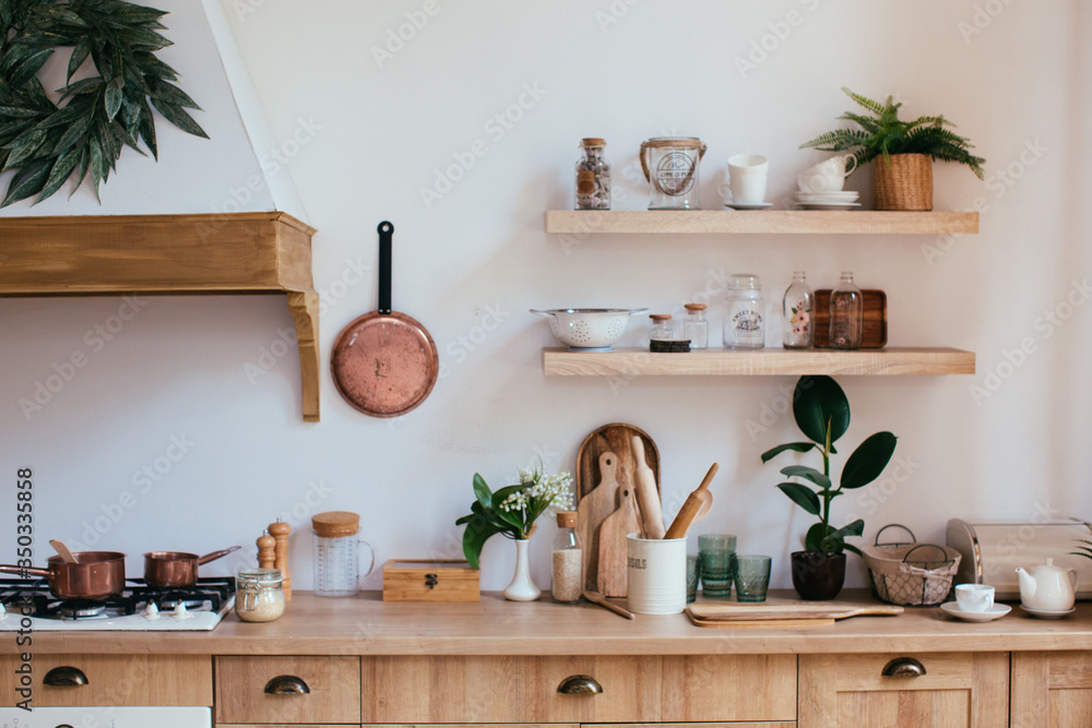 Obraz na płótnie wooden rustic kitchen table. minimalistic interior, utencils on the table w salonie