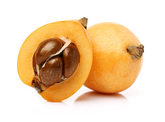 Wall Mural - Close up view of some loquat fruit isolated on a white background 