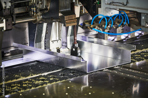 Fotomural Panel bending machine at work. process of metal sheet forming