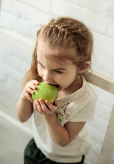 little girl eating fruit lifestyle 