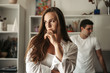 © sushytska - Upset couple ignoring each other after argument, domestic violence, divorce risk