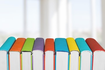 Wall Mural - Stack of colorful books collection on the desk