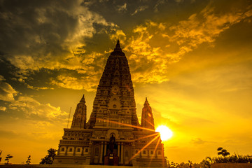 Mahabodhi Temple or Bodh Gaya Pagoda at Wat-Panyanantaram during sunrise and beautiful sky,Wat Panyanantaram is famous pagoda and popular for traveler near bangkok at PathumThani,Thailand