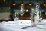 Fototapeta  - Restaurant table setting with reserved sign