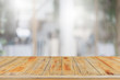 © bunditinay - Empty wood table top and blur glass window interior restaurant banner mock up abstract background - can used for display or montage your products.