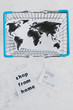 © faithie - helping businesses after the global lockdown, shopping bags and world map with Shop from home and Stay Home message