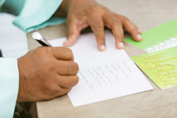 Wall Mural - Muslim man writing greeting cards for Eid al-Fitr