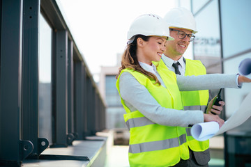 Man and woman discussing work. Colleagues working on project.