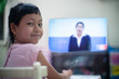 © arrowsmith2 - Little child girl learning on DLTV or Distance Learning Television at home,Social distance during quarantine, Online education concept