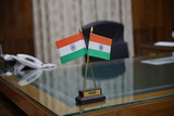 Fototapeta Krajobraz - Allahabad, Uttar Pradesh/India- May 16 2020: Indian tricolor flag placed on the big table of a government officer.
