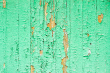 Old Green Wooden Boards With Cracked And Peeling Paint Texture Background.