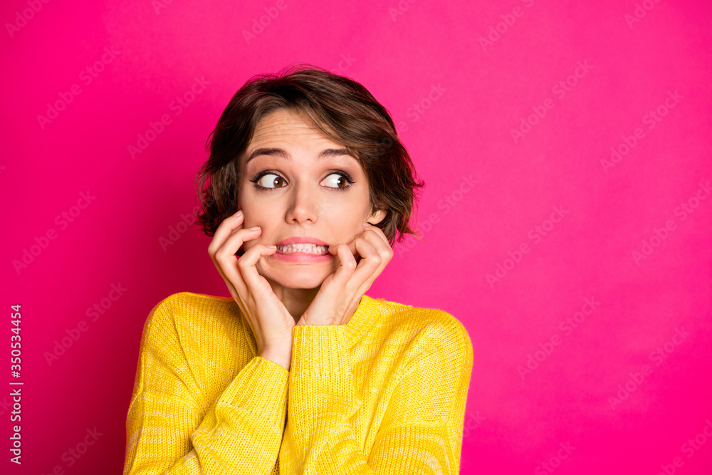 Portrait of frustrated anxious afraid girl look copyspace see she made horrible mistake bite finger nails wear sweater isolated over bright color background - obrazy, fototapety, plakaty 
