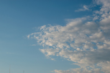 Blue sky and a wedge of white clouds