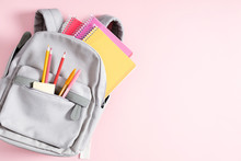 Back To School Concept. Backpack With School Supplies, Pens, Pencils, Notebook On Pastel Pink Background. Flat Lay, Top View, Copy Space