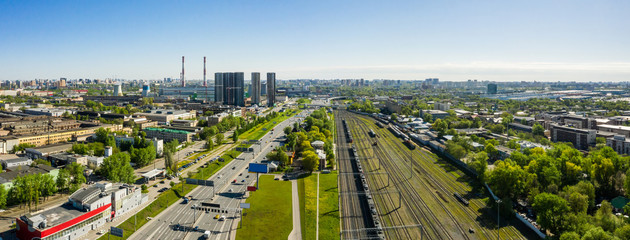 Wall Mural - Aerial top view of road junction in Moscow from above, automobile traffic and the old Ugreshskaya railway station in the Moscow industrial zone near the automobile ring highway