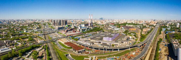 Wall Mural - Power plant pipes and cooling towers in Moscow from above, automobile traffic and the old Ugreshskaya railway station in the Moscow industrial zone near the automobile ring highway