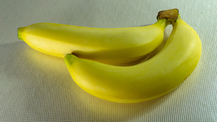 two Yellow bananas on floor