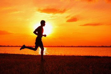 Wall Mural - Athlete runner feet running on road, Jogging at outdoors. Man running for exercise.Sports and healthy lifestyle concept.