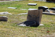 Broken Tombstones At Cemetery
