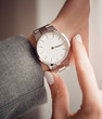 Beautiful white watch on woman hand.