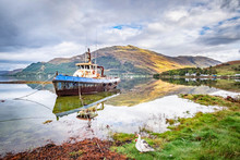 Old Boat On Loch Duich, Invershiel, In The Dramatic Highlands Of Scenic Scotland, A Fantastic Adventure Travel Destination For A Holiday Vacation To View Awesome Picturesque Scenery