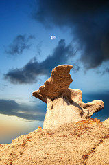 Wall Mural - the moon over a winged hoodoo bisti wilderness