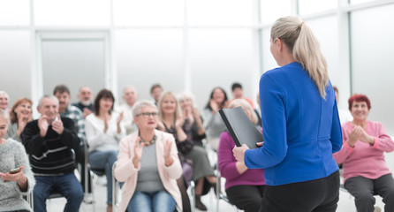 Wall Mural - Businesswoman addressing colleagues at office meeting