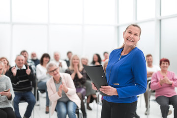 Wall Mural - Businesswoman addressing colleagues at office meeting