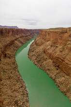 Aerial Of The Colorado River Cutting A Green Line Through The De
