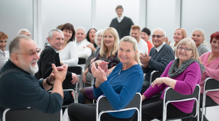adult people listen to the motivational speech of the lecturer