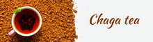 Chaga Mushroom Tea. A Cup Of Brewed Tea From Birch Fungus Chaga On A Pile Of Small Broken Pieces Isolated On White Background. Banner. Text Ofl Font