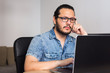 © Harry Rendón - young man teleworking