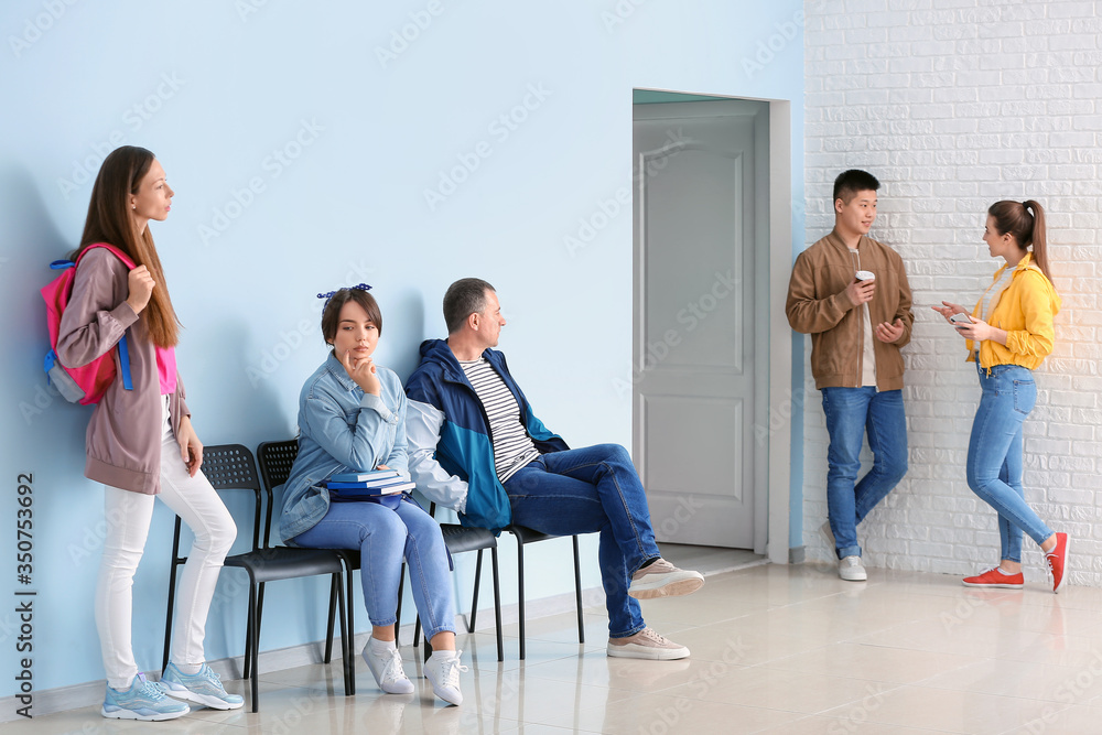 People waiting in line indoors