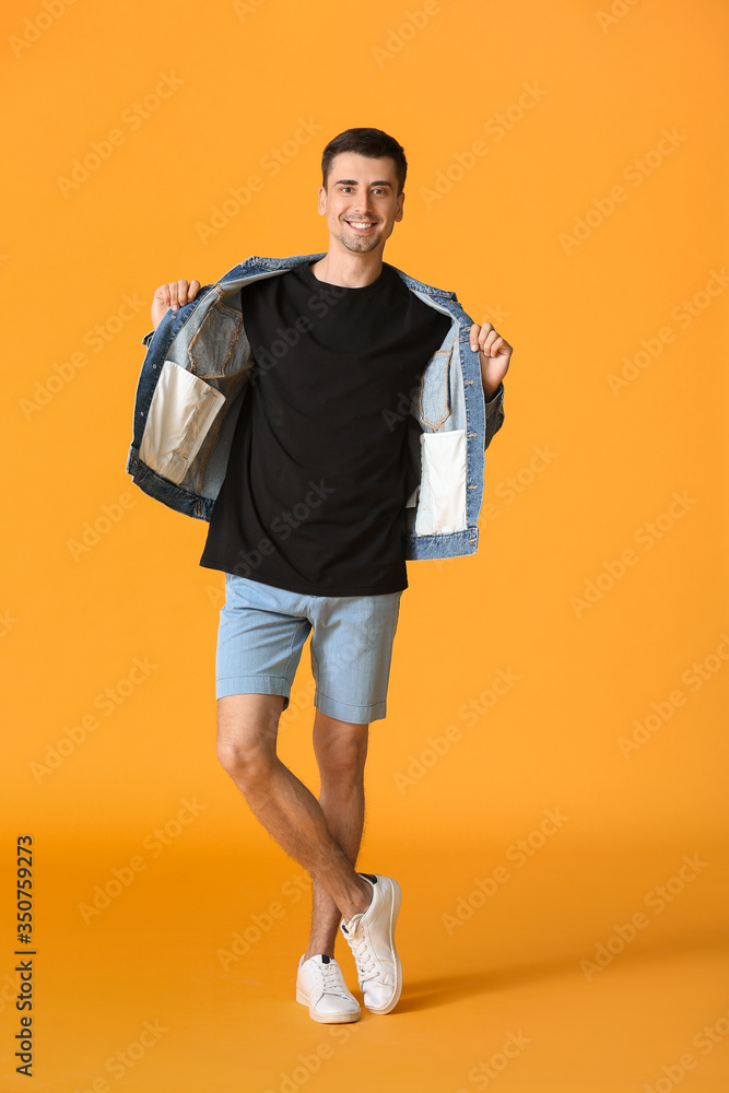 Man in stylish t-shirt on color background