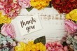 © may1985 - Thank you Card with colorful flowers border frame on wooden background