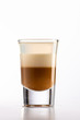 B52 coffee creamy alcohol cocktail in three layers in a shot glass on a black background