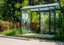 Old Abandoned Bus Stop With Broken Glass, On The Side Of The Road...