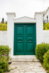 green door in a stone wall