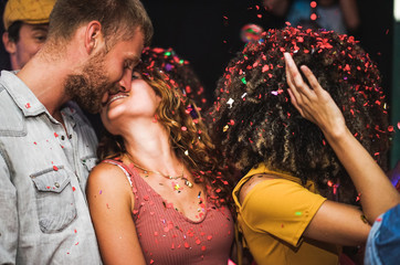 Wall Mural - Young friends dancing at home private party - Happy people having fun listening music at night - Alternative fest during Coronavirus time - Focus on man's beard