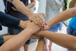 © udom - Many multiracial hands coming together as a team..
