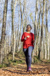 © Arpad - Pretty Spanish woman jogging in the forest in autumn time