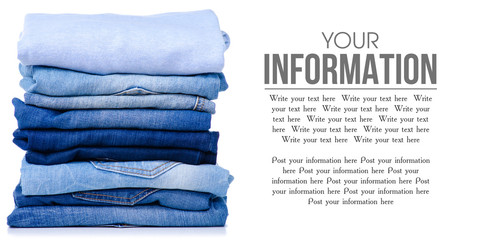 Wall Mural - Stack folded blue shirt clothing and jeans on white background isolation, space for text